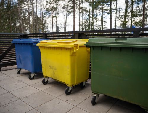 Three Colored Garbage Bins Waste Separation Placed Outdoor Pavement