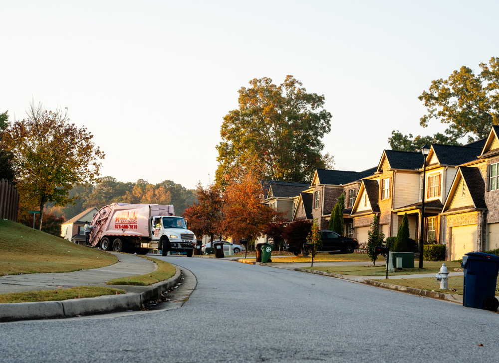 Garbage Truck Providing Curbside Trash Pickup