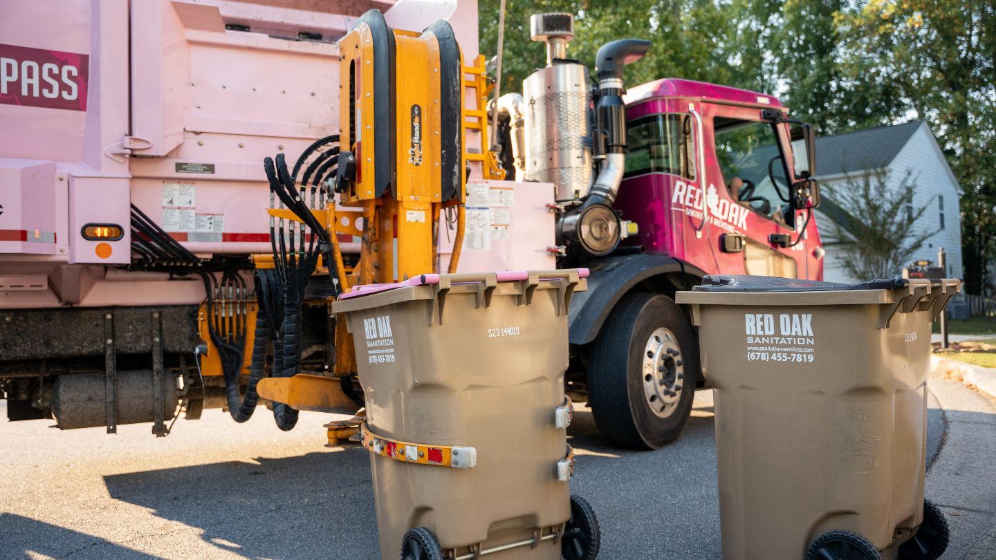 Side Loader Garbage Truck Collecting Residential Trash Bins