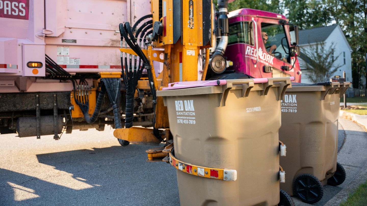 Side Loader Truck Picking Up Residential Trash Bins